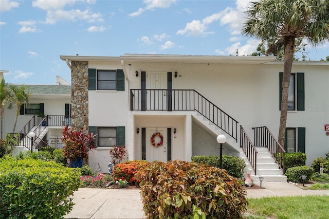 5400 34th St W Unit 5G, Bradenton, FL 34210 - view of front of house featuring stairway and stucco siding
