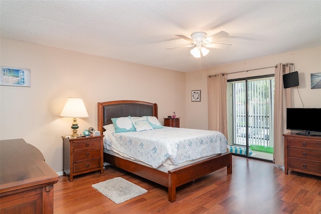 5400 34th St W Unit 5G, Bradenton, FL 34210 - bedroom featuring access to outside, light wood-type flooring, and a ceiling fan