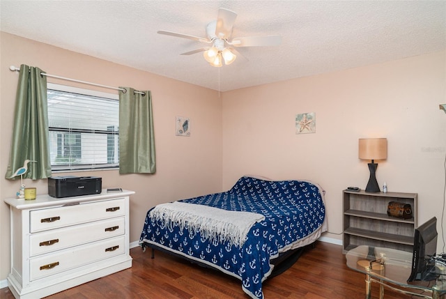 5400 34th St W Unit 5G, Bradenton, FL 34210 - bedroom featuring wood finished floors, a textured ceiling, and ceiling fan