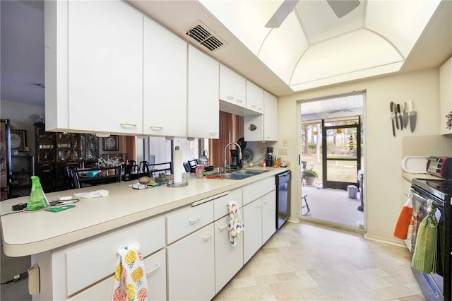 307 Rubens Dr, Nokomis, FL 34275 - kitchen with electric range oven, dishwasher, light countertops, a ceiling fan, and white cabinetry