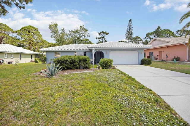 307 Rubens Dr, Nokomis, FL 34275 - single story home featuring a garage, a front lawn, concrete driveway, and stucco siding