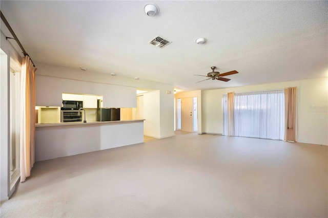 307 Rubens Dr, Nokomis, FL 34275 - unfurnished living room featuring ceiling fan