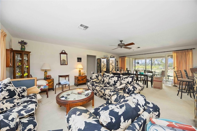 307 Rubens Dr, Nokomis, FL 34275 - carpeted living area with a ceiling fan