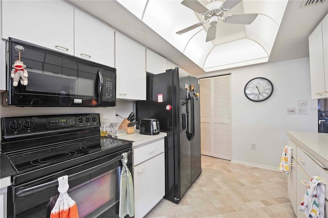 307 Rubens Dr, Nokomis, FL 34275 - kitchen featuring black appliances, white cabinetry, light countertops, and a ceiling fan