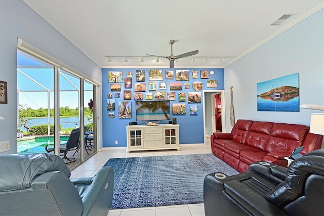 10571 Old Grove Cir, Bradenton, FL 34212 - living area with rail lighting, tile patterned floors, a ceiling fan, crown molding, and plenty of natural light