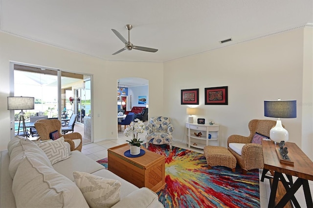10571 Old Grove Cir, Bradenton, FL 34212 - tiled living room featuring arched walkways and a ceiling fan