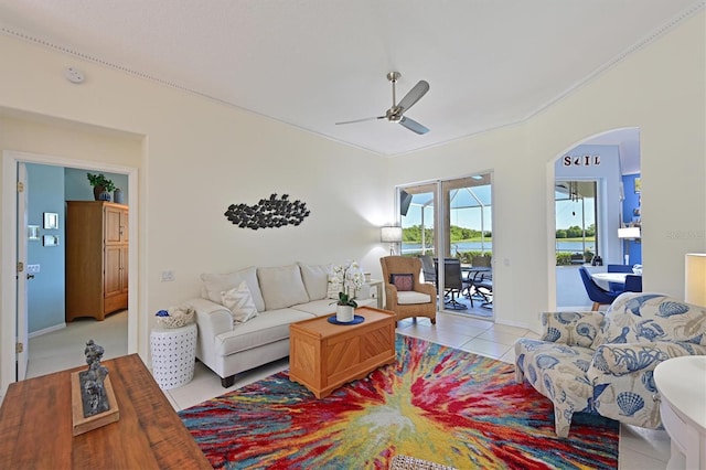 10571 Old Grove Cir, Bradenton, FL 34212 - tiled living area featuring ceiling fan, arched walkways, and ornamental molding