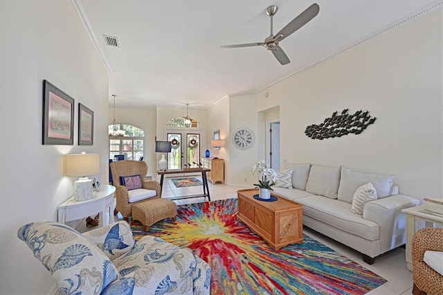10571 Old Grove Cir, Bradenton, FL 34212 - living area with light tile patterned floors, a ceiling fan, and ornamental molding