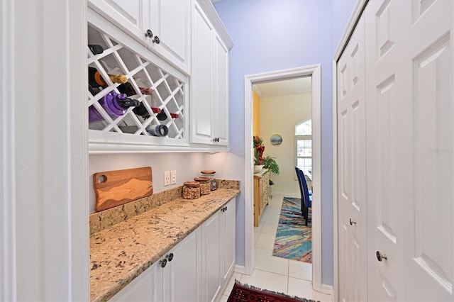 10571 Old Grove Cir, Bradenton, FL 34212 - bar area with light tile patterned floors and baseboards