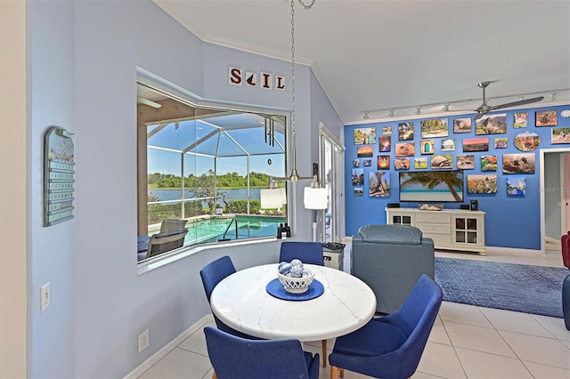 10571 Old Grove Cir, Bradenton, FL 34212 - dining room featuring a ceiling fan, a sunroom, light tile patterned flooring, and crown molding