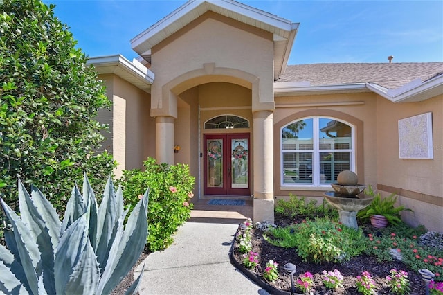 10571 Old Grove Cir, Bradenton, FL 34212 - entrance to property featuring french doors, stucco siding, and roof with shingles