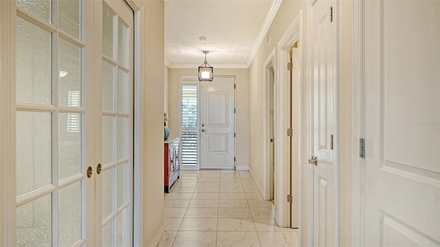 250 Hidden Bay Dr Unit 302, Osprey, FL 34229 - hallway with crown molding, french doors, and light marble finish floors