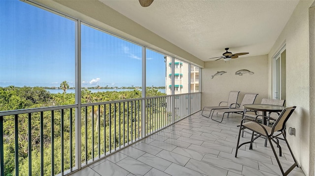 250 Hidden Bay Dr Unit 302, Osprey, FL 34229 - sunroom / solarium with a ceiling fan and a water view