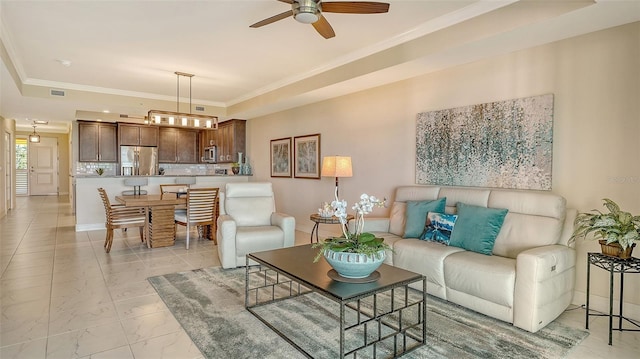 250 Hidden Bay Dr Unit 302, Osprey, FL 34229 - living room featuring a raised ceiling, ceiling fan, ornamental molding, and light marble finish floors