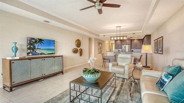 250 Hidden Bay Dr Unit 302, Osprey, FL 34229 - living room featuring a tray ceiling, ceiling fan, light marble finish flooring, and ornamental molding