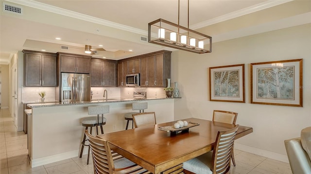 250 Hidden Bay Dr Unit 302, Osprey, FL 34229 - dining area with crown molding and recessed lighting