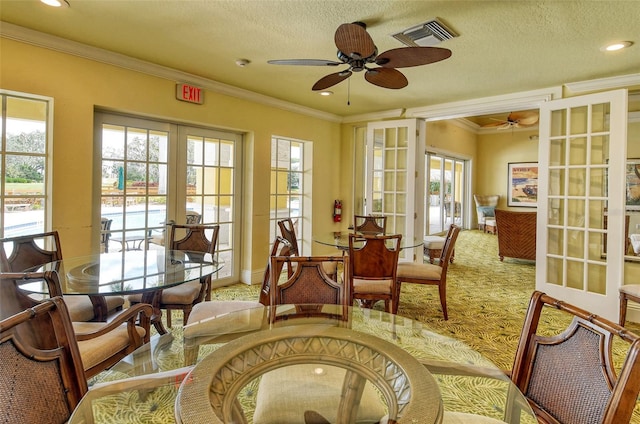 250 Hidden Bay Dr Unit 302, Osprey, FL 34229 - carpeted dining area featuring french doors, a ceiling fan, healthy amount of natural light, ornamental molding, and recessed lighting