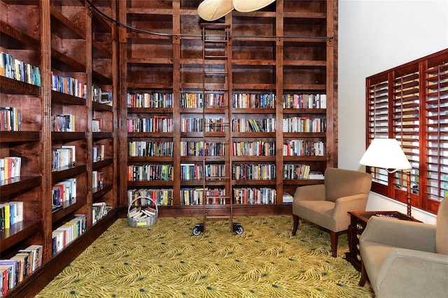 250 Hidden Bay Dr Unit 302, Osprey, FL 34229 - sitting room with wall of books