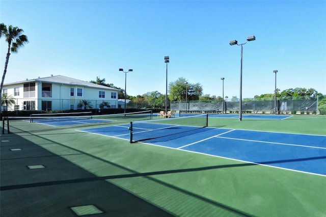 250 Hidden Bay Dr Unit 302, Osprey, FL 34229 - view of tennis court with community basketball court