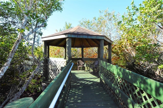250 Hidden Bay Dr Unit 302, Osprey, FL 34229 - wooden terrace featuring a gazebo