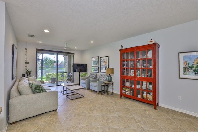 7344 Skybird Rd, Bradenton, FL 34209 - living area with recessed lighting, light tile patterned floors, and a textured ceiling
