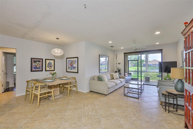 7344 Skybird Rd, Bradenton, FL 34209 - living area featuring recessed lighting, light tile patterned floors, a ceiling fan, and a textured ceiling