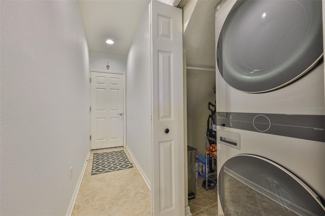 7344 Skybird Rd, Bradenton, FL 34209 - washroom featuring stacked washer / drying machine, light tile patterned flooring, and recessed lighting