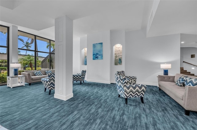 5855 Midnight Pass Rd Unit 416, Sarasota, FL 34242 - living room featuring dark carpet, healthy amount of natural light, and stairway