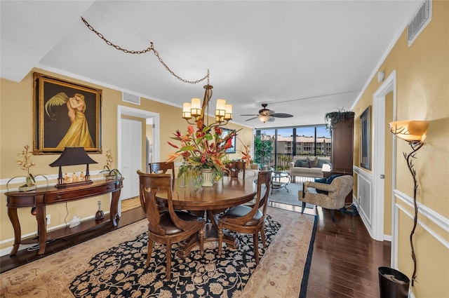 5855 Midnight Pass Rd Unit 416, Sarasota, FL 34242 - dining area with wood finished floors, a chandelier, a ceiling fan, and ornamental molding
