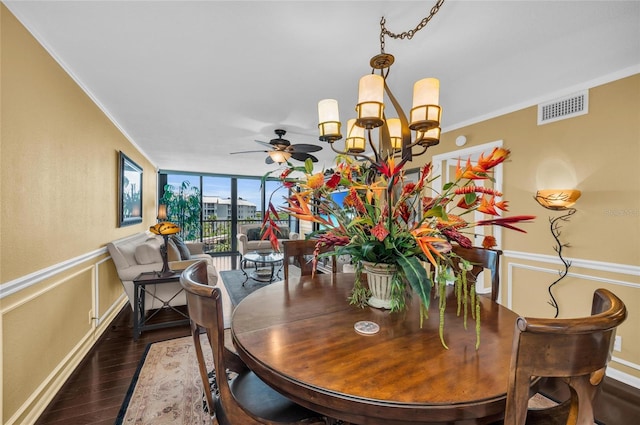 5855 Midnight Pass Rd Unit 416, Sarasota, FL 34242 - dining room with crown molding, wood finished floors, a chandelier, ceiling fan, and wainscoting