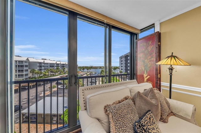 5855 Midnight Pass Rd Unit 416, Sarasota, FL 34242 - bedroom featuring a water view and baseboards