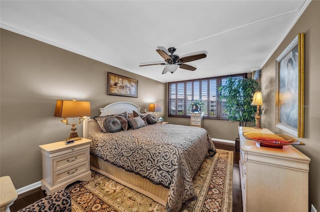 5855 Midnight Pass Rd Unit 416, Sarasota, FL 34242 - bedroom with wood finished floors, a ceiling fan, and crown molding