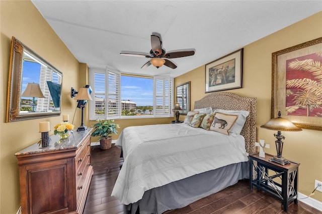5855 Midnight Pass Rd Unit 416, Sarasota, FL 34242 - bedroom with dark wood-style flooring and a ceiling fan