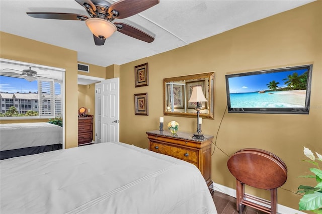5855 Midnight Pass Rd Unit 416, Sarasota, FL 34242 - bedroom with ceiling fan and wood finished floors