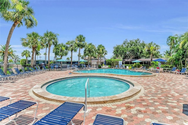 5855 Midnight Pass Rd Unit 416, Sarasota, FL 34242 - community pool featuring a patio