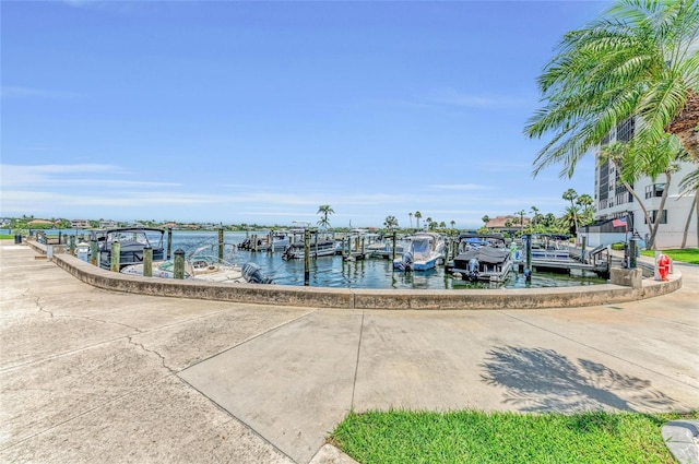 5855 Midnight Pass Rd Unit 416, Sarasota, FL 34242 - dock featuring a water view and boat lift