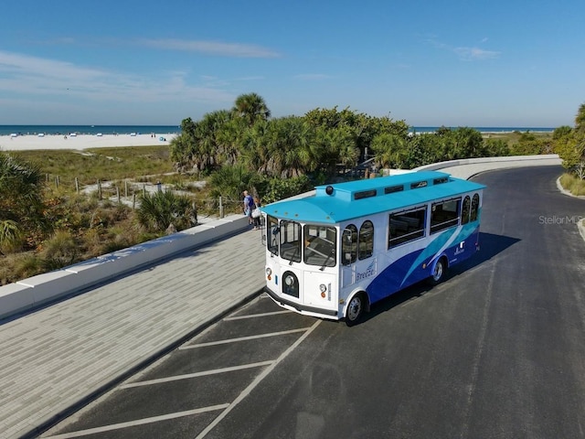 5855 Midnight Pass Rd Unit 416, Sarasota, FL 34242 - uncovered parking lot with view of water and beach