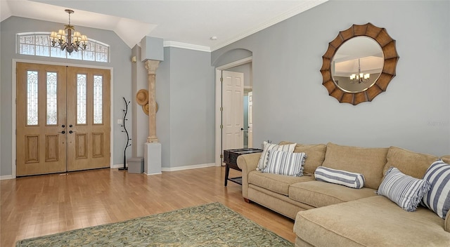 6206 Stillwater Ct, University Park, FL 34201 - entrance foyer with a chandelier, wood finished floors, arched walkways, and vaulted ceiling