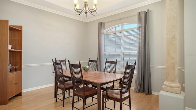 6206 Stillwater Ct, University Park, FL 34201 - dining room with a chandelier, light wood-style flooring, and crown molding