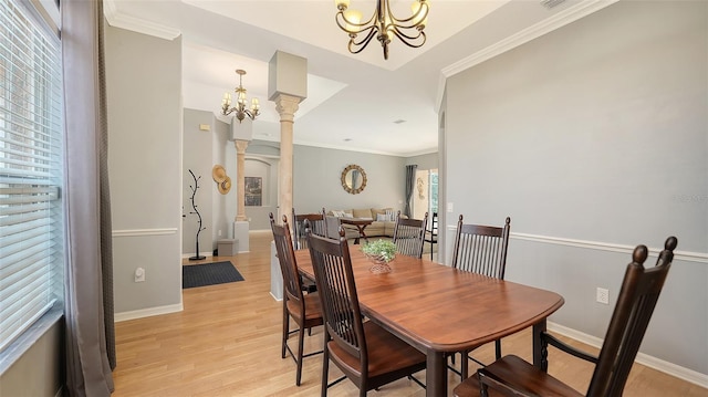 6206 Stillwater Ct, University Park, FL 34201 - dining area with a chandelier, decorative columns, plenty of natural light, and ornamental molding