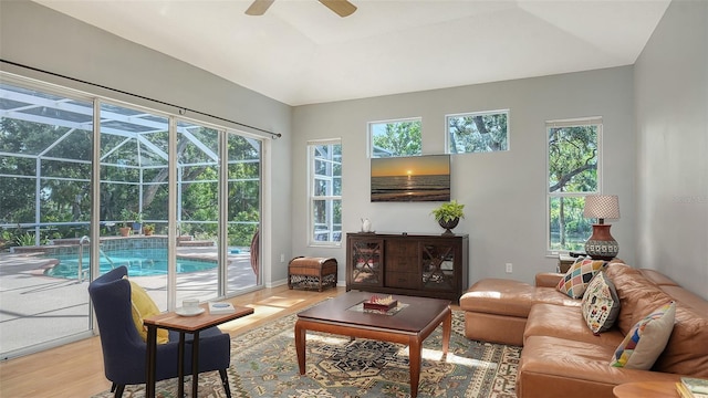 6206 Stillwater Ct, University Park, FL 34201 - living area featuring plenty of natural light, a ceiling fan, light wood finished floors, and a sunroom