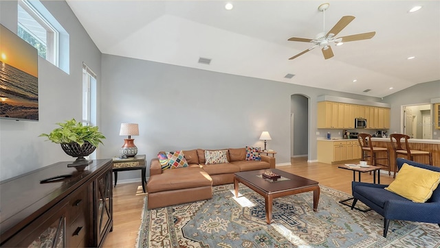 6206 Stillwater Ct, University Park, FL 34201 - living area featuring lofted ceiling, light wood-style flooring, arched walkways, a ceiling fan, and recessed lighting