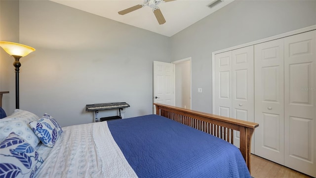 6206 Stillwater Ct, University Park, FL 34201 - bedroom featuring a closet, light wood-style flooring, ceiling fan, and lofted ceiling