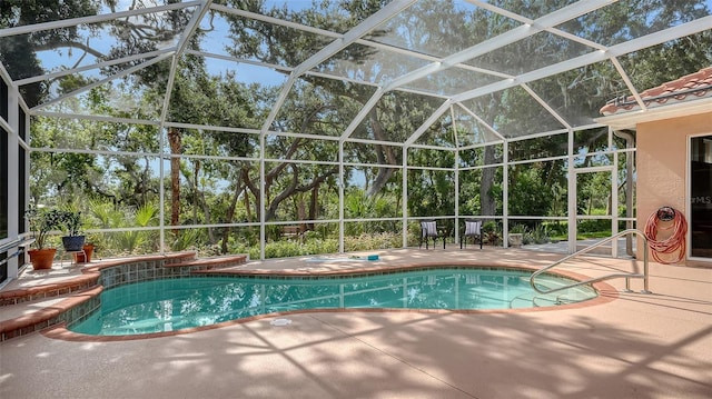 6206 Stillwater Ct, University Park, FL 34201 - outdoor pool with a patio area, glass enclosure, and view of wooded area