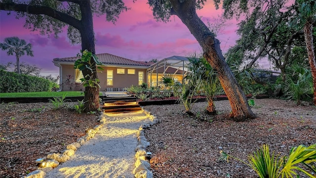 6206 Stillwater Ct, University Park, FL 34201 - view of front of property featuring stucco siding, glass enclosure, and a tile roof