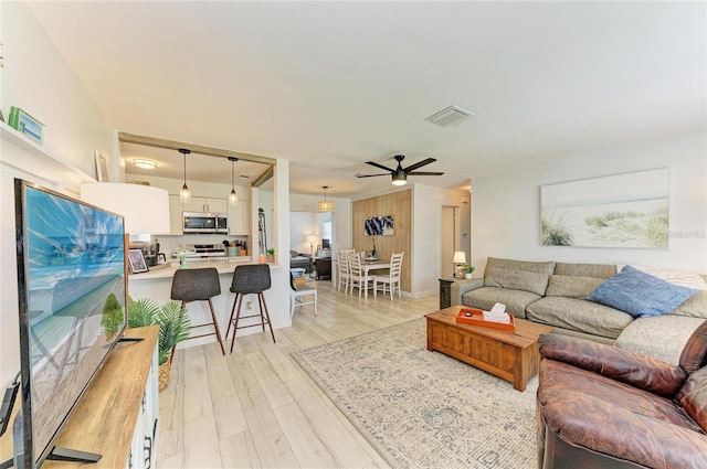 237 Saxon Cir, Venice, FL 34293 - living area featuring ceiling fan and light wood-style floors