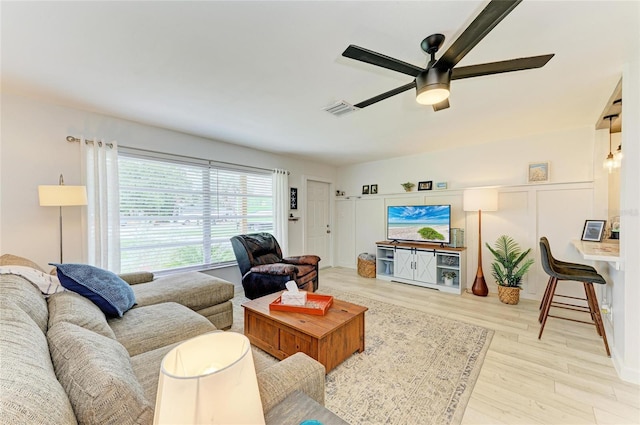 237 Saxon Cir, Venice, FL 34293 - living room featuring a ceiling fan and wood finished floors