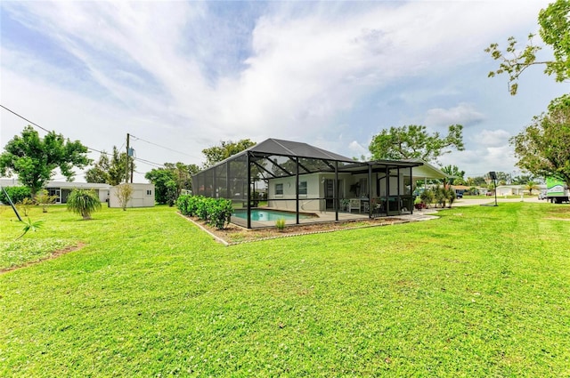 237 Saxon Cir, Venice, FL 34293 - view of green lawn featuring glass enclosure, a patio, and an outdoor pool
