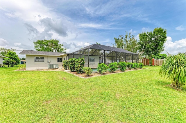 237 Saxon Cir, Venice, FL 34293 - back of property with a yard, a storage shed, and a lanai