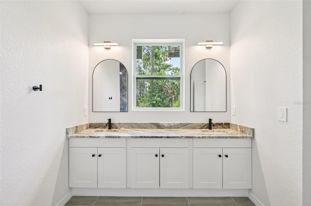2523 Hagerick Ln, North Port, FL 34288 - full bathroom with double vanity and tile patterned flooring